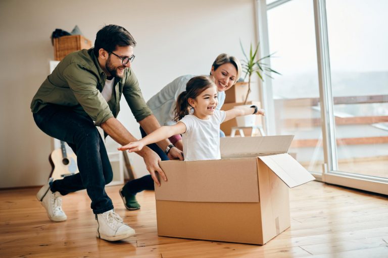 happy-daughter-having-fun-with-her-parents-while-relocating-new-apartment